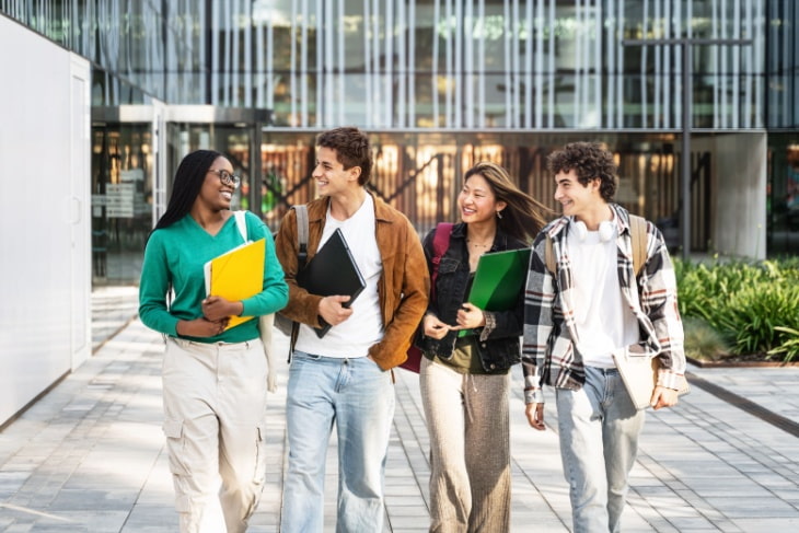 a group of students walk together on campus