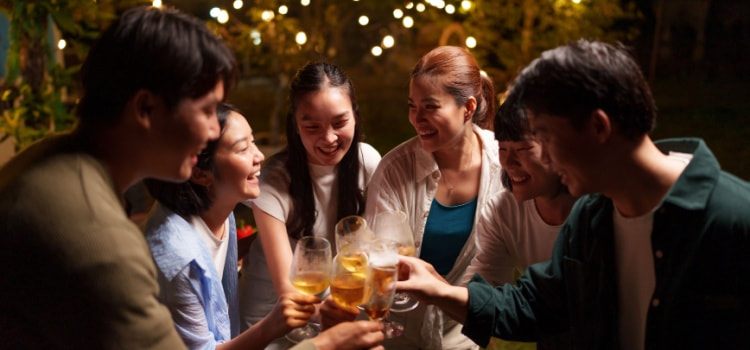friends cheers their drinks during a celebration